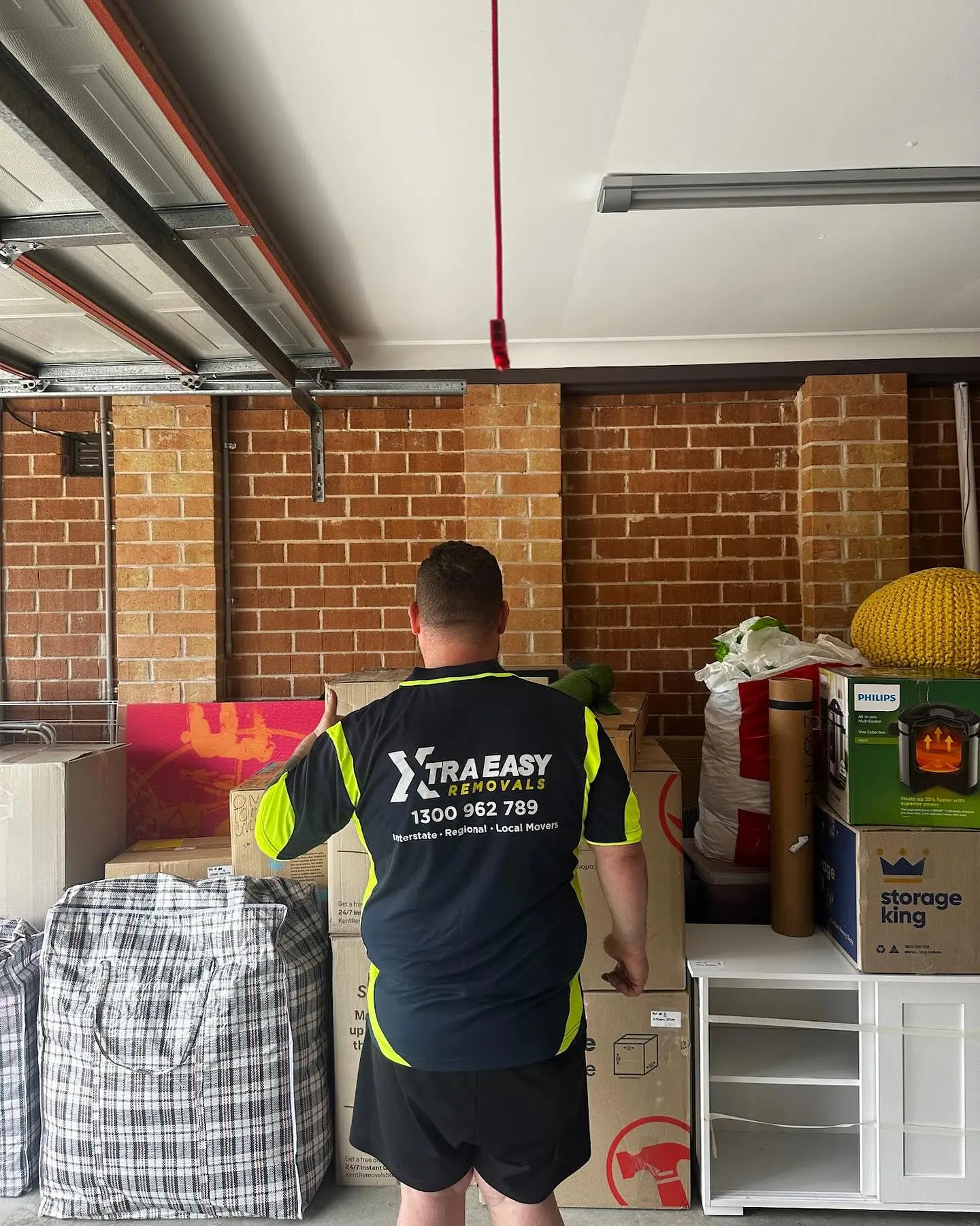 Interstate removalists Sydney Adelaide team unloading a backload delivery of household furniture and boxes