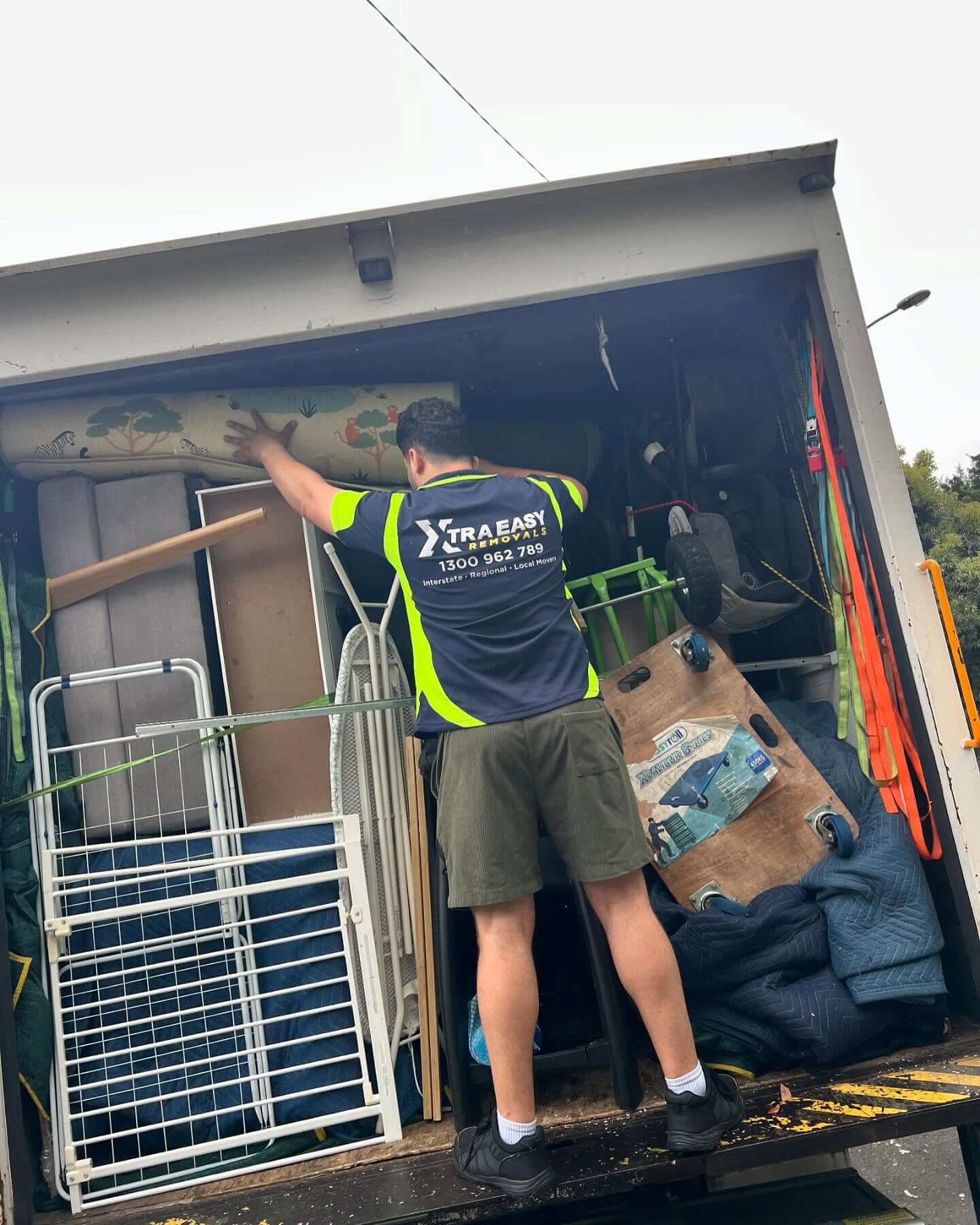 A tight access doorway doesn't slow this Sydney to Adelaide removalists team moving furniture through